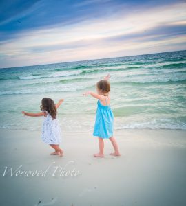 beautiful beach photos of two little kids on the white sandy beaches